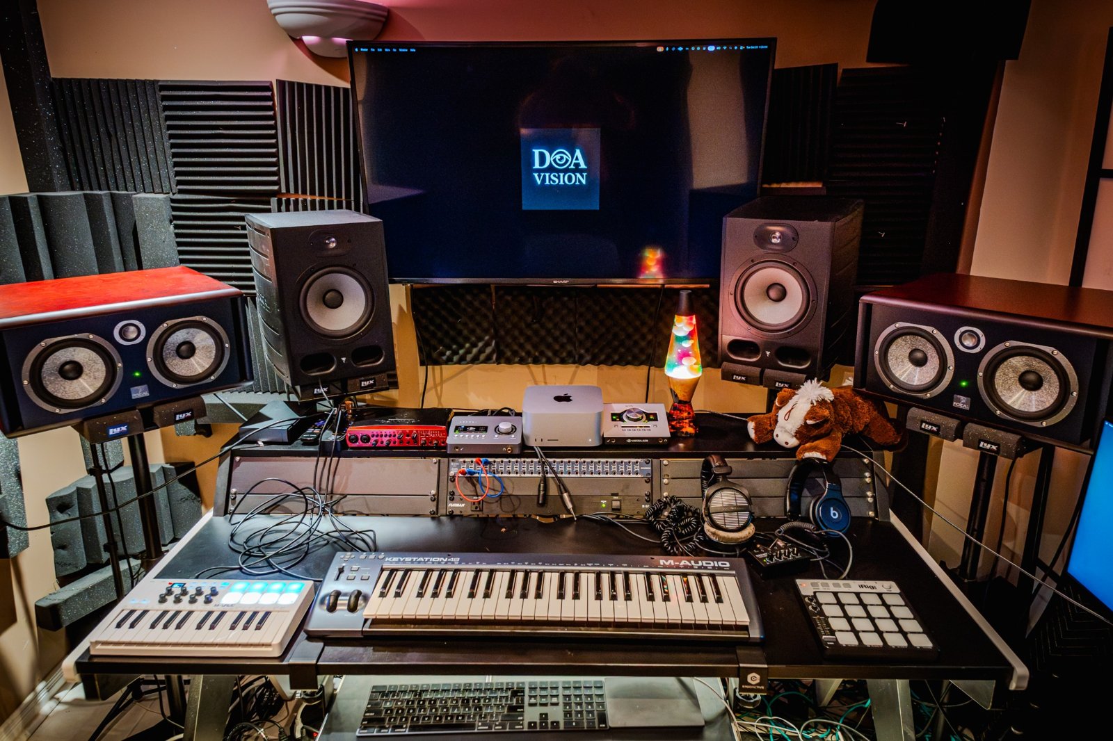Daniel’s mixing workspace with monitors, keyboards and D.A Vision on screen